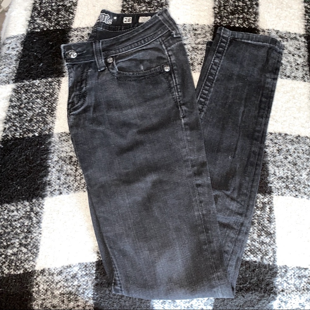 Faded black MISS ME book cut jeans